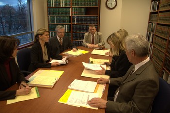 Several people sitting around the table